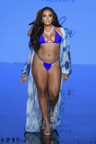 Angela Simmons - Angela Simmons makes her Miami Swim week debut rocking a tiny blue bikini and sis is looking good. She walked in the Mate Collection show on Saturday in Miami. &quot;About last night 💎&nbsp;#UnFilterRawPhoto&nbsp;#CurvyGal&nbsp;#XBNB,&quot; read her Instagram caption. We're happy to see real bodies on the runway!&nbsp;(Photo by Arun Nevader/Getty Images for Art Hearts Fashion) (Photo by Arun Nevader/Getty Images for Art Hearts Fashion)