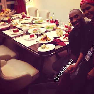 Kobe Bryant - Greetings from Manila! Kobe Bryant and a friend smile for the cameras before enjoying a large dinner menu in the Philippines.  (Photo: Kobe Bryant via Instagram)