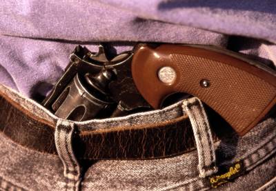 Guns in Public Places - A number of states allow residents to carry concealed weapons on their person or nearby if they obtain a concealed carry permit. Rules regarding these permits vary by state. (Photo: GettyImages)
