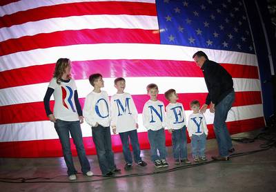 Give Me an &quot;R&quot; - The Fisher family spells out exactly how they feel for Romney at a campaign rally in Elko, Nevada, in February 2012.  (Photo: AP Photo/Gerald Herbert)