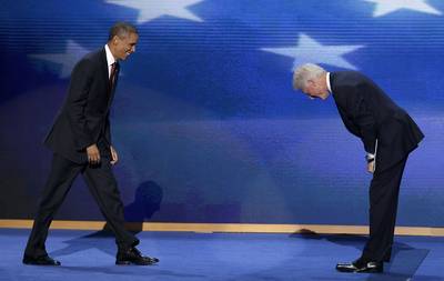 I Bow to You - Former President Bill Clinton bows as Obama walks on stage after Clinton's hearty and widely praised endorsement of the president at the Democratic National Convention in Charlotte, North Carolina.   (Photo: AP Photo/J. Scott Applewhite)