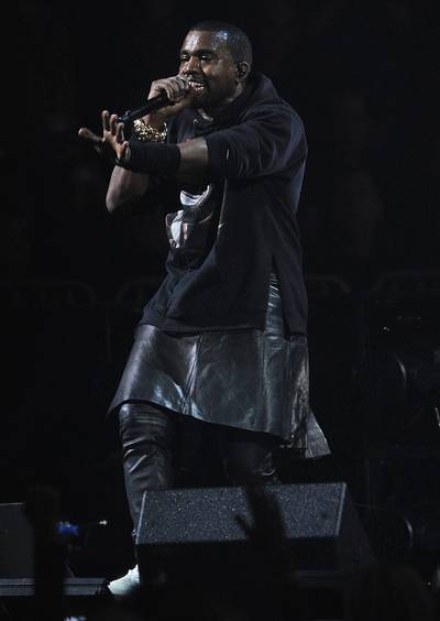 Good Deeds - Kanye West hits the stage in a black leather kilt and hoodie to perform at &quot;12-12-12,&quot; a concert benefiting The Robin Hood Relief Fund to aid victims of Hurricane Sandy. The concert, which aired on HBO was presented by Clear Channel Media &amp; Entertainment, The Madison Square Garden Company and The Weinstein Company and held at Madison Square Garden in New York City. (Photo: Larry Busacca/Getty Images for Clear Channel)