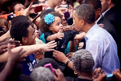 Never Too Young - &nbsp;A young supporter reaches out to Obama at his ''A Vision for Virginia's Middle Class'' campaign event in Glen Allen, Virginia.&nbsp;  (Photo: Alex Wong/Getty Images)