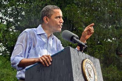 Neither Rain Nor Sleet - Obama braves the rain while speaking at a campaign event in Glen Allen, Virginia.  (Photo: J. Scott Applewhite/ AP Photo)&nbsp;