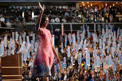 Dressed for Success - The first lady inspired Democrats to vote for Obama and obsess over her dress.  (Photo: Jae C. Hong/AP)