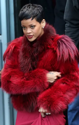 Ravishing Red - Rihanna looks stunning in red fur as she leaves a recording studio in Paris. The mega pop star jetted over to Paris from Germany to spend time with Chris Brown. (Photo: FameFlynet)