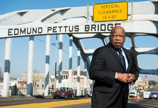 Selma, Revisited - On the 50th anniversary of “Bloody Sunday,” Rep. John Lewis stands on the Edmund Pettus Bridge in Selma, where he was beaten by police during an attempted march for voting rights from Selma to Montgomery.