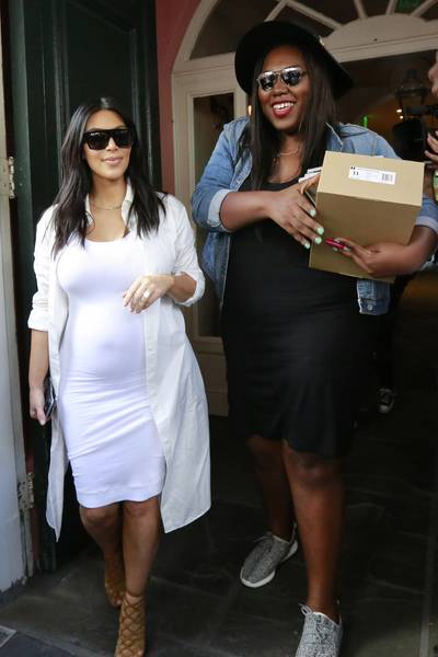 Fan Club - Kim Kardashian surprises her superfan Myleeza Mingo with a lunch date in New Orleans. Mingo got a pair of Yeezys — lucky girl! — and a signed copy of Kim and Kanye West's Vogue cover as a birthday gift from her idol.&nbsp; (Photo: PacificCoastNews)
