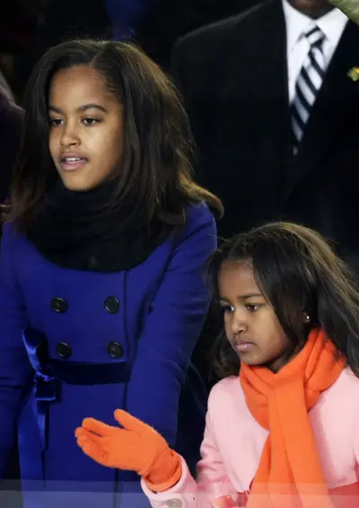 Front and Center - The sisters took in the inaugural parade celebrating their father's first term in office in 2009. (Photo: Alex Wong/Getty Images)