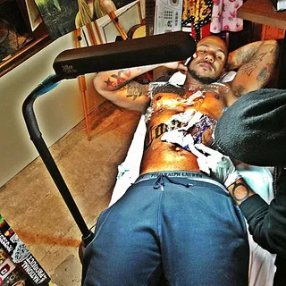 Game @thegame - West coast rapper Game posted this flick of himself getting yet another tat added to his collection.&nbsp;(Photo: Instagram via Game)