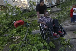 Take Shelter! - Dwayne Riley fled to the basement when the storm hit his home in Minneapolis on Sunday.(Photo: AP Photo/The Star Tribune, Richard Tsong-Taatarii)