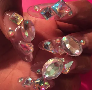 Santigold - The singer-rapper goes for heavy bling: translucent gemstones in shapes of ovals, squares, circles and teardrops. (Photo: Santigold via Instagram)