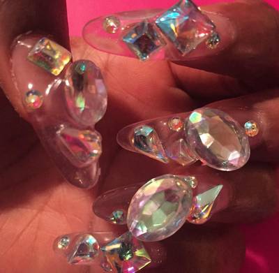 Santigold - The singer-rapper goes for heavy bling: translucent gemstones in shapes of ovals, squares, circles and teardrops. (Photo: Santigold via Instagram)