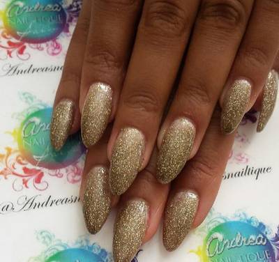 Angela Simmons - The fashion designer must have the Midas touch, because these glittery, gilded tips are everything! Notice the ombre effect from the base of her nail to the tip.  (Photo: Angela Simmons via Instagram)