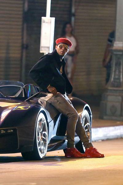 Beast Mode - Chris Brown leans against one very expensive prop — a Rezvani Beast sports car worth $165,000 — while on a break from shooting the music video for his single &quot;Liquor.&quot; (Photo: Miguel Aguilar, PacificCoastNews)