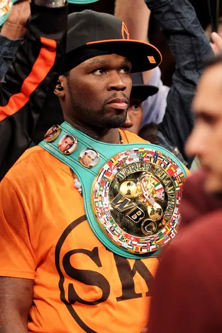 Brotherly Love\r - Rapper 50 Cent stands in the ring as a line of support for friend Floyd Mayweather Jr. before Mayweather's&nbsp;victory over Victor Ortiz in their WBC welterweight title fight at the MGM Grand Garden Arena in Las Vegas. (Photo: Al Bello/Getty Images)