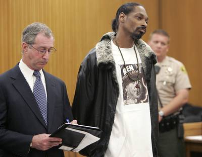 Snoop Dogg - Snoop got off with five years probation after police found guns in his vehicle and his home in 2006.  (Photo: REUTERS/Mel Melcon)