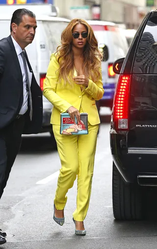 Go Bold - Beyoncé&nbsp;is all about bright colors as of late and this gorgeous yellow pantsuit is right on target as she's seen out and about in New York City.(Photo: PacificCoastNews)