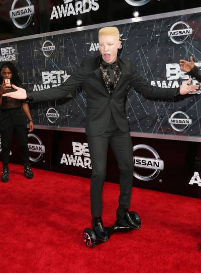 Shaun Ross - The fashion model works his best angles in a chic black suit teamed with a see-through lace undershirt. We likely!  (Photo: Frederick M. Brown/Getty Images for BET)