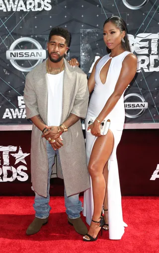 Omarion and Apryl Jones - The “Post to Be" singer’s 'fit&nbsp;looks straight out of a J.Crew catalog while his model-esque lady wears a white gown with a thigh-high slit. Such a handsome couple!&nbsp; (Photo: Frederick M. Brown/Getty Images for BET)