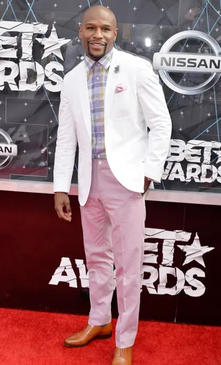 Floyd Mayweather Jr. - Just call him money, because Mayweather&nbsp;is looking rich! He makes a powerful statement in classic suiting pieces in soft shades of pastel. (Photo: Earl Gibson/BET/Getty Images for BET)