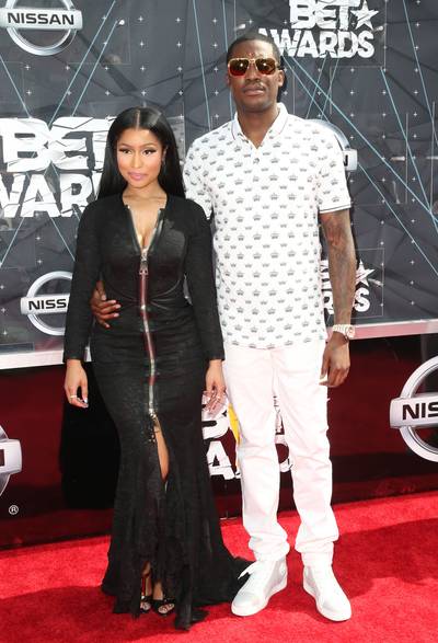 Nicki Minaj and Meek Mill - Hip hop’s reigning king and queen have arrived. Nicki&nbsp;flaunts ample cleavage in a zip-front black lace gown, while her king&nbsp;keeps it casual in a white printed T-shirt, white denim and crisp sneakers.   (Photo: Earl Gibson/BET/Getty Images for BET)