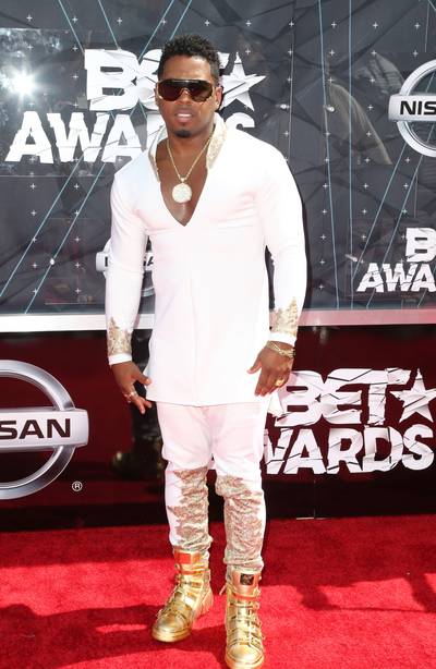 Bobby V - The singer keeps his white outfit simple so his gold boots can really take center stage. (Photo: Frederick M. Brown/Getty Images for BET)