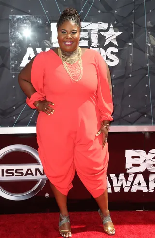 Raven Goodwin - The Being Mary Jane actress is red-dy for anything! We love the draping and split-sleeves of this red-orange jumper.  (Photo: Frederick M. Brown/Getty Images for BET)