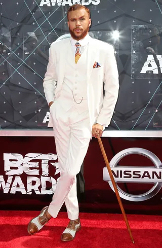 Jidenna - The recording artist lives up to his song "Classic Man." Everything from his white suit to his accessories looks like it was pulled straight out of the Harlem Renaissance. (Photo: Frederick M. Brown/Getty Images for BET)