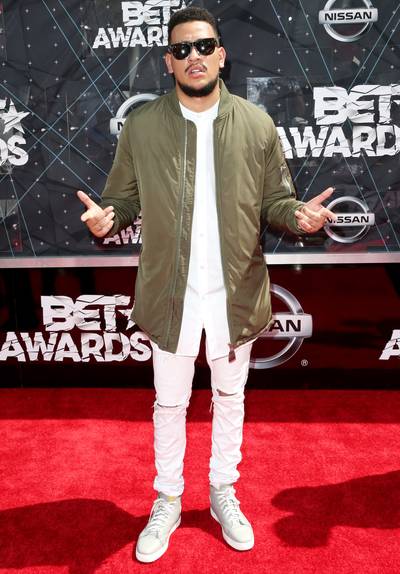 AKA - The Levels rapper puts together white and olive green. Neutrals are a refreshing take for a rapper on the red carpet and we ain’t mad!&nbsp; (Photo: Frederick M. Brown/Getty Images for BET)