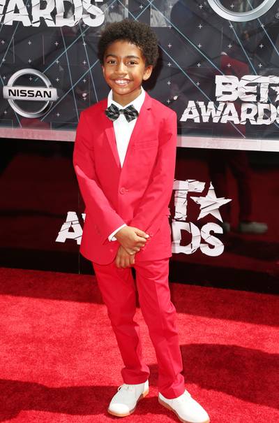 Miles Brown - Isn’t it adorable how the pint-size&nbsp;Black-ish actor wanted to match the red carpet? His black bow-tie has him looking like a little gentleman.&nbsp;  (Photo: Frederick M. Brown/Getty Images for BET)