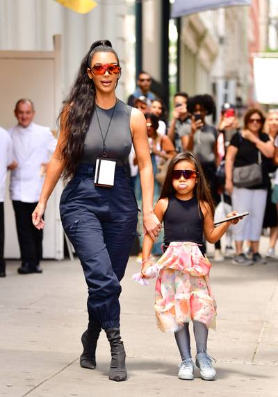 Matching Mirrored Sunnies - North West was spotted sticking her tongue out to the paps while wearing matching shades with her mom in NYC to celebrate her 5th birthday weekend. (Photo: James Devaney/GC Images)