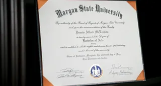 College Grad - McLendon aslo graduated from Morgan State University with a B.A. in history. He proudly showcases his diploma.  (Photo: BET)