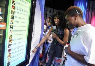 Brandy Takes Some Tweets - Brandy reviews operation of the Twitter and Facebook board at 106 &amp; Park, August 14, 2012. (Photo: John Ricard / BET)