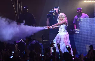 Ring the Alarm - Nicki Minaj sprays her screaming fan with a misty fog while performing onstage during her Pepsi Presents Nicki Minaj's Pink Friday Tour at Roseland Ballroom in New York City.(Photo: Larry Busacca/Getty Images for Pepsi)