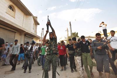 Free Syria Army Finds Victories - In late July 2012, Syria’s rebel faction, Free Syria Army, posted several victories including the seizure of Aleppo, the main city of the North and the capture of 150 government troops. &nbsp;(Photo: AP Photo/ Khalil Hamra)