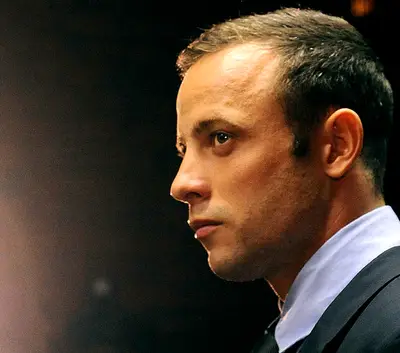Oscar Pistorius' Uncle Says He Is Not Suicidal - Oscar Pistorius &quot;is certainly not suicidal,&quot; said his uncle, Arnold Pistorius, Monday. The Olympian's close friend, Mike Azzie, told the news that Oscar Pistorius was &quot;on the verge of suicide&quot; and &quot;broken&quot; after having to sell personal belongings to cover his legal costs.(Photo: AP Photo/Themba Hadebe, File)