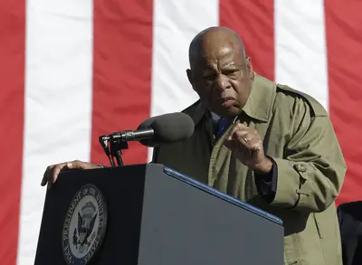 Speaking From Experience - Lewis delivers one of his trademark fiery&nbsp;speeches at the foot of the Edmund Pettus Bridge.  (Photo: AP Photo/Dave Martin)