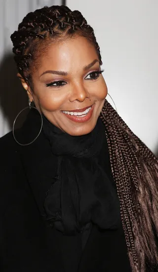 Throwback - Janet decided to bring back the box braids at Milan Fashion Week. She pulled them back in a low ponytail and went for a smoky bronze eye.  (Photo: Vincenzo Lombardo/Getty Images for Giuseppe Zanotti Design)