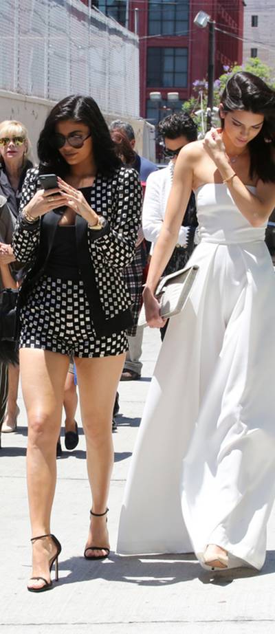 Sister, Sister - Kendall and Kylie Jenner lead the pack as they walk together and ahead of the rest of the fam during a family outing in Los Angeles. &nbsp;(Photo: PacificCoastNews)