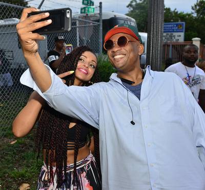 Me Oh Mya - Mya poses for an 'usie' backstage with a fan at the Overtown Music and Arts Festival in Miami.(Photo: JLN Photography/WENN.com)