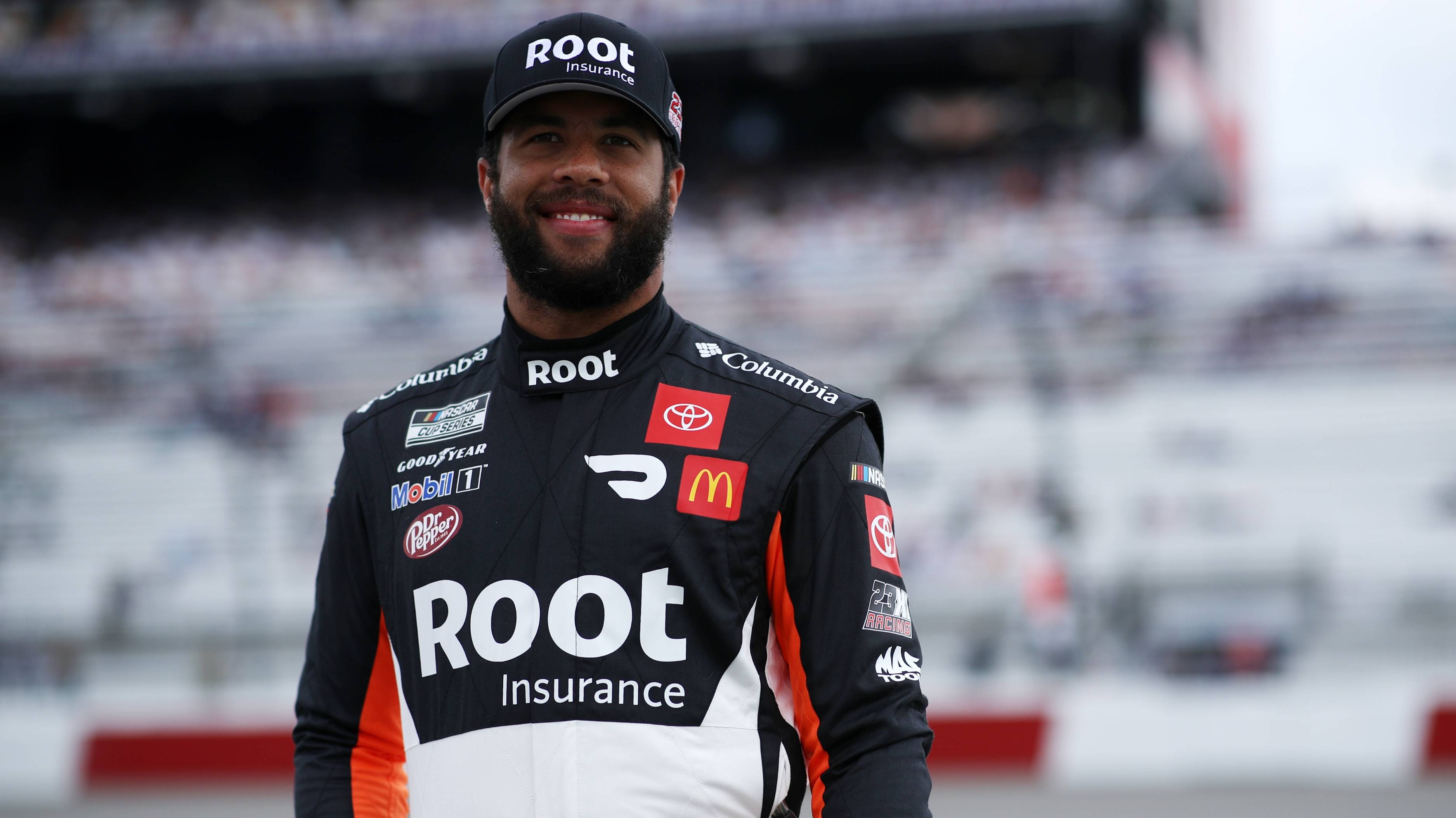 Bubba Wallace, driver of the #23 Root Insurance Toyota, poses on the grid prior to the NASCAR Cup Series Toyota Owners 400 at Richmond Raceway on April 18, 2021 in Richmond, Virginia. 