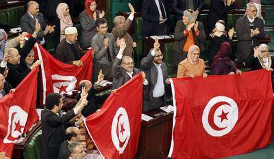 Tunisia Passes New Constitution - After two years of debates, Tunisia finally has a new constitution, which is being called one of the most progressive in the Arab world. The new document passed on Sunday and includes freedom of religion and women’s rights.(Photo: REUTERS/Zoubeir Souissi)