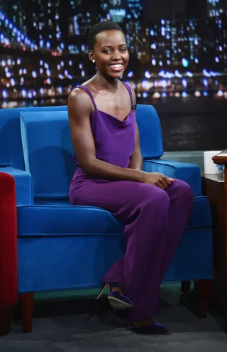 Fashion Darling - Lupita Nyong'o&nbsp;is stunning in a purple jumpsuit as she chats on the couch at Late Night With Jimmy Fallon at Rockefeller Center in New York City.  (Photo: Theo Wargo/Getty Images)