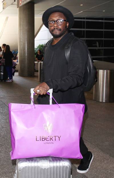 Just Touched Down - Super-producer Will.I.Am arrives back in his hometown of Los Angeles and waits for his ride at LAX airport.&nbsp;(Photo: Splash News)