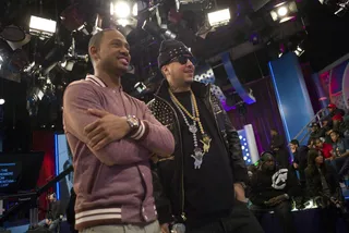 Look Here - French Montana and Terrence J watch as the premiere of "Shot Caller Remix" plays at 106 &amp; Park, February 21, 2012. (Photo: John Ricard / BET)