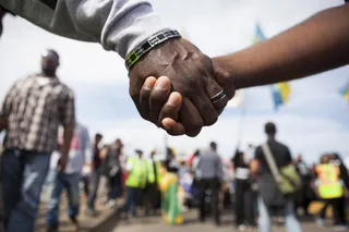 Unbreakable Bond - Participants held on to each other in solidarity as they crossed the Edmund Pettus Bridge.&nbsp;(Photo: Ty Wright/BET)