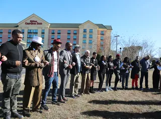 Linking to the Past - Before setting off on the Celebrity Bus Ride to Selma the participants took a moment to honor those who protested 50 years ago with a prayer.&nbsp;  (Photo: Johnny Nunez / BET)