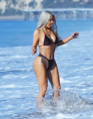 Kim Kardashian - Mrs. West hit the beach in sunny Malibu in a thong bikini.(Photo:&nbsp;BYLINE DPXIMAGES/Getty Images)