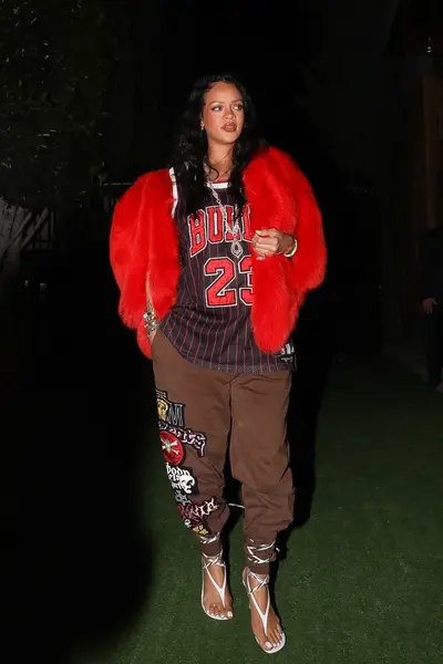 021722-style-rihanna-frames-her-growing-baby-bump-with-the-return-of-her-iconic-15000-saint-laurent-heart-shaped-jacket.jpg